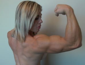 posing in sexy panties to show you her powerful pecs, vascular biceps