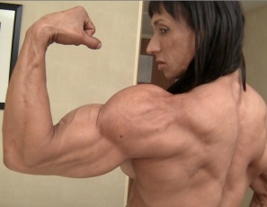 Professional female bodybuilder Tazzie Colomb is looking vascular and ripped as she poses in her hotel bedroom after the Arnold Classic. As she displays her muscles powerful pecs,  legs, glutes, calves,  biceps and abs, and plays with her panties, she asks you...